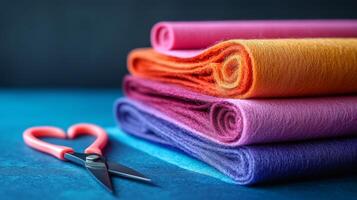 A stack of colorful felt and scissors photo