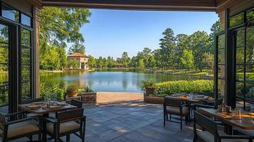 A view of a lake and a patio with tables and chairs photo