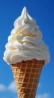 A waffle cone with whipped cream on top photo