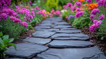 Stone path with flowers in the garden photo