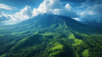 A mountain range with green vegetation and clouds photo