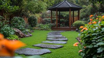 A garden with a gazebo and stone path photo