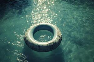 An inflatable ring floating in the water photo