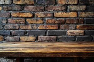 An empty wooden table in front of a brick wall photo