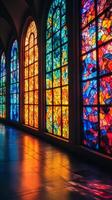 A room with many colorful stained glass windows photo