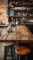 A bar table with stools and bottles of liquor photo