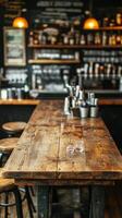 A bar with a wooden table and stools photo