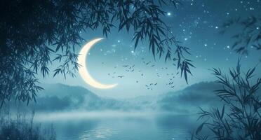 A moon and trees in the night with a river photo