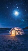 A dome tent in the desert with stars above it photo