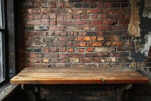 A wooden table in front of a brick wall photo