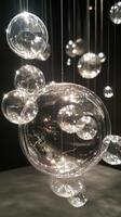 A bunch of clear bubbles hanging from a ceiling photo