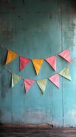 Colorful paper bunting on a wall photo