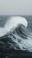 A large wave breaking on the ocean photo