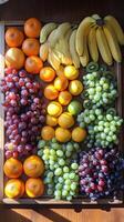 A wooden tray with a bunch of different fruits photo