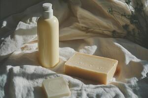 A bottle of soap and a bar of soap photo