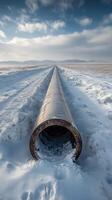 A pipe in the middle of a snowy field photo