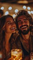 A man and woman laughing together at a bar photo