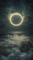 A ring of light is seen over the ocean photo