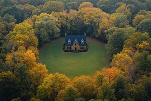 An aerial view of a house surrounded by trees photo