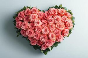 Heart shaped pink roses on a light background photo