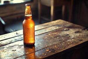 A beer bottle sitting on a wooden table photo