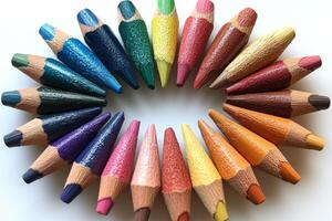 A circle of colored pencils arranged in a circle photo