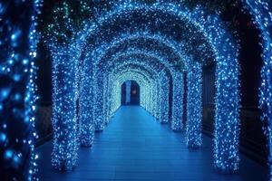 A walkway with blue lights and arches photo