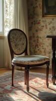 A chair sitting in front of a table with a lamp on it photo