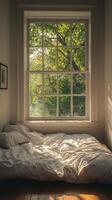 A bed with a window in the room photo