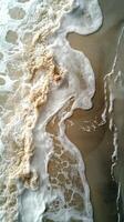 An aerial view of a wave on the beach photo