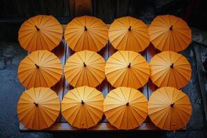 A row of orange umbrellas photo