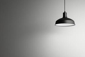Black and white photo of a lamp hanging from a wall