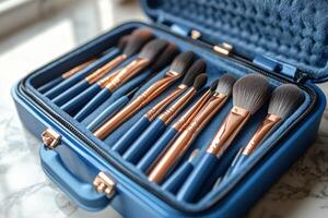 A blue case with several makeup brushes in it photo