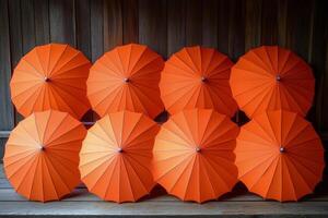 A row of orange umbrellas photo