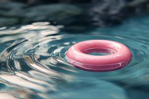 A pink ring floating in the water photo
