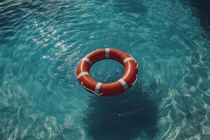 An orange life preserver floating in the water photo