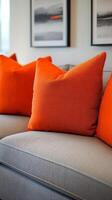 A couch with orange pillows photo