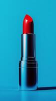 Lipstick on blue background photo