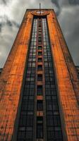 A tall building with a clock on the side photo