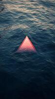 A triangle floating in the water photo