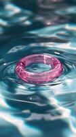 A pink ring floating in the water photo