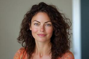 A woman with curly hair and green eyes photo