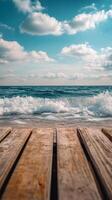 Wooden boardwalk on the beach with waves and sky photo