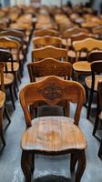 Rows of wooden chairs in a room photo