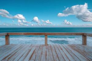 A wooden deck overlooking the ocean and sky photo