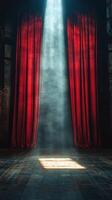 A red curtain is open in front of a stage photo