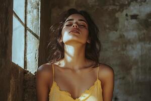 A woman in a yellow dress looking up photo