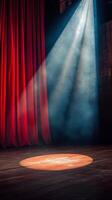 A red curtain with a spotlight shining on it photo