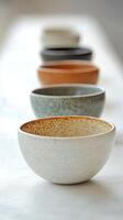 A row of bowls sitting on a table photo