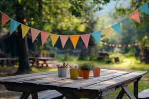 A picnic table with colorful bunting hanging from it photo
